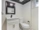 This bathroom includes a modern sink, vanity, mirror, and toilet at 201 E Simon Nw Ter, Atlanta, GA 30318