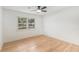 Bright bedroom featuring hardwood floors, a ceiling fan, and natural light from one window at 201 E Simon Nw Ter, Atlanta, GA 30318