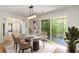 Dining room featuring a modern light fixture and access to outdoor balcony at 201 E Simon Nw Ter, Atlanta, GA 30318