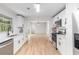Bright, updated kitchen featuring white cabinets, stainless steel appliances, and hardwood floors at 201 E Simon Nw Ter, Atlanta, GA 30318