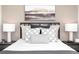 Tastefully decorated bedroom with a black metal frame bed and matching bedside tables at 357 Skylar Se Ct, Atlanta, GA 30315