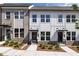 Up close exterior view featuring the brick and siding detail of the townhomes, and the professionally landscaped yards at 357 Skylar Se Ct, Atlanta, GA 30315