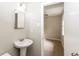 Bathroom with pedestal sink and access to bedroom at 8857 Ashwood Dr, Riverdale, GA 30274