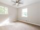 Inviting bedroom with sunlit windows and ceiling fan at 8857 Ashwood Dr, Riverdale, GA 30274