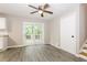 Dining area features wood-look floors and sliding glass doors to a deck at 8857 Ashwood Dr, Riverdale, GA 30274