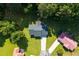 Overhead shot of a residential property nestled amongst mature trees, showcasing its lot and surrounding environment at 10 Casey Ln, Cartersville, GA 30121