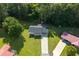 Aerial view of a single-Gathering home highlighting its spacious, well-manicured lawn and proximity to lush greenery at 10 Casey Ln, Cartersville, GA 30121