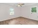 This bedroom features hardwood floors, two windows with views, and a modern ceiling fan at 10 Casey Ln, Cartersville, GA 30121