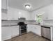 Bright kitchen features stainless steel appliances, white cabinets, modern countertops, and a double oven at 10 Casey Ln, Cartersville, GA 30121
