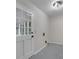 Bright laundry room with patterned floors and a glass paneled exterior door at 10 Casey Ln, Cartersville, GA 30121