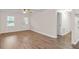 Bright living room features new wood floors, a ceiling fan, and white walls at 10 Casey Ln, Cartersville, GA 30121