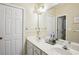 Bathroom featuring double sinks, and a large mirror at 132 Eagles Club Dr, Stockbridge, GA 30281