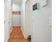 Hallway featuring hardwood floors, white walls, and closet at 132 Eagles Club Dr, Stockbridge, GA 30281