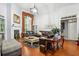 Bright living room featuring hardwood floors, a fireplace, and a cozy seating area at 132 Eagles Club Dr, Stockbridge, GA 30281