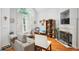 Comfortable living space featuring vaulted ceilings, a fireplace, and large windows with natural light at 132 Eagles Club Dr, Stockbridge, GA 30281