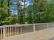 This home features a spacious deck overlooking a lush green landscape at 219 Eagles Landing Way, Mcdonough, GA 30253