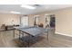 Finished basement recreation area with ping pong table and durable floors at 219 Eagles Landing Way, Mcdonough, GA 30253