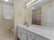 Well-lit bathroom featuring a vanity with a large mirror and plenty of counter space at 219 Eagles Landing Way, Mcdonough, GA 30253