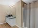 Functional bathroom with a vanity, mirror, and shower-tub combo, for your convenience at 219 Eagles Landing Way, Mcdonough, GA 30253