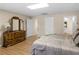 Cozy bedroom with a dresser and wood-look floors offering a restful retreat at 219 Eagles Landing Way, Mcdonough, GA 30253