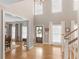 Bright foyer with hardwood floors, high ceilings, and a staircase at 219 Eagles Landing Way, Mcdonough, GA 30253