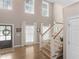 Bright foyer with hardwood floors, high ceilings, and a staircase at 219 Eagles Landing Way, Mcdonough, GA 30253