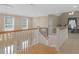 Second floor hallway with stairs that leads down to the main level of the home at 219 Eagles Landing Way, Mcdonough, GA 30253