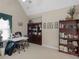 Bright upstairs living area with a desk, built-in shelves, and a window with a view at 219 Eagles Landing Way, Mcdonough, GA 30253