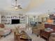 Open-concept living and dining area with hardwood floors and a view of the backyard at 219 Eagles Landing Way, Mcdonough, GA 30253