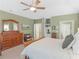 Large main bedroom with light green walls and a lovely wooden dresser at 219 Eagles Landing Way, Mcdonough, GA 30253