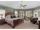 Relaxing main bedroom suite offering natural light and a sitting area at 219 Eagles Landing Way, Mcdonough, GA 30253