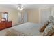 Spacious main bedroom with a ceiling fan and ample storage in the wooden dresser at 219 Eagles Landing Way, Mcdonough, GA 30253
