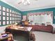 Spacious, carpeted office with a large desk, ample natural light, and traditional decor at 219 Eagles Landing Way, Mcdonough, GA 30253