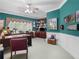 Inviting office space with teal walls, built-in shelving, large desk and charming traditional decor at 219 Eagles Landing Way, Mcdonough, GA 30253