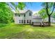 Spacious backyard with deck, surrounded by lush greenery at 2312 Mahogany Glen Pl, Lawrenceville, GA 30043