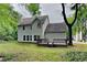 Backyard featuring a wooden deck and lush green landscaping, perfect for outdoor living at 2312 Mahogany Glen Pl, Lawrenceville, GA 30043