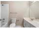 Bathroom with a shower-tub, toilet, and vanity with a sink at 2312 Mahogany Glen Pl, Lawrenceville, GA 30043