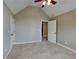Bright bedroom with vaulted ceilings, carpet, and neutral walls offers a tranquil retreat at 2312 Mahogany Glen Pl, Lawrenceville, GA 30043