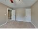 Bedroom featuring neutral walls and carpet with a doorway leading to a staircase adds unique character at 2312 Mahogany Glen Pl, Lawrenceville, GA 30043