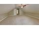 Bedroom featuring neutral walls, carpet, and vaulted ceiling with a door at 2312 Mahogany Glen Pl, Lawrenceville, GA 30043
