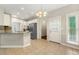 Eat-in kitchen featuring tile floors, granite counters, and stainless appliances at 2312 Mahogany Glen Pl, Lawrenceville, GA 30043