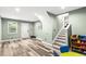 Spacious finished basement featuring durable floors, neutral paint, and stairs to another level at 5006 Dekalb Way, Stone Mountain, GA 30087