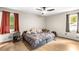 Neutral bedroom with wood floor, ceiling fan, and two windows at 5006 Dekalb Way, Stone Mountain, GA 30087
