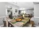 Charming dining area with wood-look floors, seating for four, and an open view into the living room at 5006 Dekalb Way, Stone Mountain, GA 30087