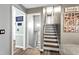 Hallway and staircase featuring wood-look floors and views into adjacent living spaces at 5006 Dekalb Way, Stone Mountain, GA 30087