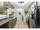 Well-lit kitchen with stainless steel appliances, sleek countertops, and wood-look flooring at 5006 Dekalb Way, Stone Mountain, GA 30087