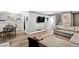 Spacious living room with wood-look floors, dining area, and a comfortable sectional sofa at 5006 Dekalb Way, Stone Mountain, GA 30087
