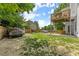 Backyard view of two-story home with wooden deck and fencing at 8436 Cyprus Ridge Way, Douglasville, GA 30134