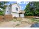 Backyard view of two-story home with wooden deck at 8436 Cyprus Ridge Way, Douglasville, GA 30134