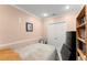 Cozy bedroom featuring a comfortable bed, ample storage, and built in shelving for books and decor at 8436 Cyprus Ridge Way, Douglasville, GA 30134